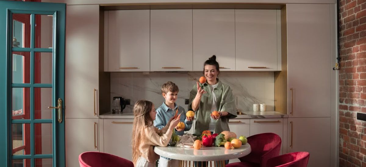 Mother with children preparing meals with fresh ingredients in a modern kitchen.